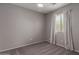 This carpeted bedroom has a bright window and neutral colored walls at 1753 E Pinto Dr, Gilbert, AZ 85296