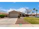 Charming single-story home featuring a well-maintained front yard with a two car garage at 1753 E Pinto Dr, Gilbert, AZ 85296