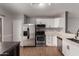 Modern kitchen featuring stainless steel appliances, white cabinets, and a stylish countertop at 1753 E Pinto Dr, Gilbert, AZ 85296