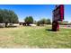 Finley Farms Elementary School with lush green lawn and clear blue skies on a sunny day at 1753 E Pinto Dr, Gilbert, AZ 85296