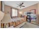 Comfortable bedroom featuring carpet, a ceiling fan, and an area to store blankets at 18033 W Carmen Dr, Surprise, AZ 85388