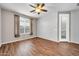 Bedroom with hardwood floors, neutral paint, and natural light from the window at 18033 W Carmen Dr, Surprise, AZ 85388
