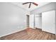 This bedroom boasts an closet, door, and modern wood flooring, and is freshly painted at 18033 W Carmen Dr, Surprise, AZ 85388