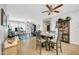 Dining area with tile floors, view into the living space and archway to other rooms at 18033 W Carmen Dr, Surprise, AZ 85388