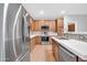 Well-equipped kitchen showcasing stainless steel appliances, light cabinets, and bright countertops at 18033 W Carmen Dr, Surprise, AZ 85388