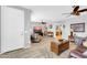 Open living room featuring wood-look floors, ceiling fans, and natural light at 18033 W Carmen Dr, Surprise, AZ 85388