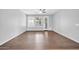 Open-plan living area with neutral colors, tile floors, and patio access at 18033 W Carmen Dr, Surprise, AZ 85388