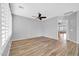 Spacious living room with wood-style floors and natural light at 18033 W Carmen Dr, Surprise, AZ 85388