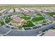 Stunning aerial view of a Primary-planned community showcasing amenities like tennis courts and a clubhouse at 1804 E Amaranth Trl, Queen Creek, AZ 85140