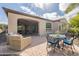 Covered patio and outdoor dining set in the backyard at 1804 E Amaranth Trl, Queen Creek, AZ 85140