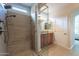 Bathroom with tiled glass walk-in shower with dual shower heads and seating at 1804 E Amaranth Trl, Queen Creek, AZ 85140