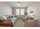 Bright bedroom boasts natural light, neutral color scheme, and dual seating at 1804 E Amaranth Trl, Queen Creek, AZ 85140