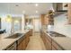 Spacious kitchen featuring a farmhouse sink, stainless steel appliances, and ample cabinetry at 1804 E Amaranth Trl, Queen Creek, AZ 85140