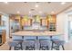 Spacious kitchen island with seating, pendant lighting, and stainless steel appliances at 1804 E Amaranth Trl, Queen Creek, AZ 85140