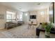 Bright living room with large windows and stylish furniture at 1804 E Amaranth Trl, Queen Creek, AZ 85140