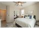 Inviting bedroom featuring a bed with ample pillows and decor and mirrored closet at 1804 E Amaranth Trl, Queen Creek, AZ 85140