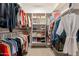 A very large walk-in closet with shelves and hanging racks for organizing clothing at 1804 E Amaranth Trl, Queen Creek, AZ 85140