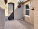 Inviting front entrance featuring a decorative security door and a charming tiled patio at 19765 N Swan Ct, Maricopa, AZ 85138