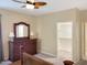 Bright main bedroom features a ceiling fan, closet, neutral walls, and carpeted floors at 19765 N Swan Ct, Maricopa, AZ 85138