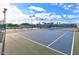 A view of well maintained tennis court with bright lights for evening games at 19765 N Swan Ct, Maricopa, AZ 85138