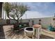 Backyard seating area with a fire pit, grill, and space for outdoor entertaining at 2002 E Mitchell Dr, Phoenix, AZ 85016