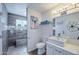 Modern bathroom featuring stylish fixtures and a spacious walk-in shower with wooden-look tile and bench at 2002 E Mitchell Dr, Phoenix, AZ 85016