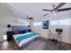 Bright bedroom featuring a plush rug, mounted AC unit and modern decor at 2002 E Mitchell Dr, Phoenix, AZ 85016