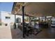 Large covered patio featuring a dining table and outdoor seating with a clear view of the pool and backyard at 2002 E Mitchell Dr, Phoenix, AZ 85016