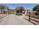 Charming single-story home featuring a well-manicured yard with colorful plants, desert landscaping, and a covered carport at 2002 E Mitchell Dr, Phoenix, AZ 85016