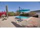 Backyard featuring a small refreshing pool surrounded by gravel and desert landscaping at 2002 E Mitchell Dr, Phoenix, AZ 85016