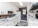 Efficient kitchen featuring white cabinetry, modern appliances, and a functional layout at 2061 E Bayberry Ave, Mesa, AZ 85204