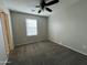 Bedroom with carpet floors, neutral walls, and natural light at 2107 N 77Th Dr, Phoenix, AZ 85035