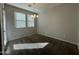 Dining room with carpet floors, neutral walls, chandelier, and natural light at 2107 N 77Th Dr, Phoenix, AZ 85035