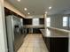 Modern kitchen features granite countertops and stainless steel appliances at 2107 N 77Th Dr, Phoenix, AZ 85035