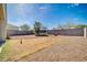 Backyard with gravel landscaping and a trampoline, enclosed by a block wall at 214 N 190Th Dr, Buckeye, AZ 85326