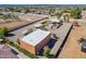 Aerial view of the property featuring a pool, multiple structures, and horse training areas at 22005 N 86Th Ave, Peoria, AZ 85383