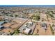 Aerial view of the property showcasing the horse arena, surrounding landscape, and community at 22005 N 86Th Ave, Peoria, AZ 85383