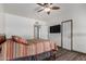 Bedroom features wood laminate flooring and closet doors at 22005 N 86Th Ave, Peoria, AZ 85383