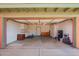 Spacious garage with storage cabinets and an open layout, perfect for organization and projects at 22005 N 86Th Ave, Peoria, AZ 85383