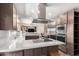 Modern kitchen with an island, stainless steel appliances, and wood cabinets at 22005 N 86Th Ave, Peoria, AZ 85383