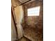 A tiled shower featuring neutral toned tile at 22005 N 86Th Ave, Peoria, AZ 85383