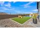 This expansive backyard has a pool, artificial turf, and minimal maintenance, perfect for outdoor living at 2205 E Fallen Leaf Ln, Phoenix, AZ 85024