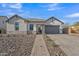 Beautiful single-Gathering home boasts a stone accent and a well-manicured desert landscape at 2205 E Fallen Leaf Ln, Phoenix, AZ 85024