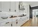 Sleek kitchen with white cabinets, marble countertops, and contemporary design at 2205 E Fallen Leaf Ln, Phoenix, AZ 85024