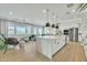 Bright open-concept kitchen featuring a large marble island and stainless steel appliances at 2205 E Fallen Leaf Ln, Phoenix, AZ 85024