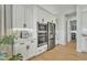 Contemporary kitchen with white cabinetry and stainless steel appliances, creating a chef-friendly space at 2205 E Fallen Leaf Ln, Phoenix, AZ 85024