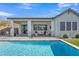 Gorgeous backyard pool with covered patio and seating area perfect for outdoor entertaining and relaxing at 2205 E Fallen Leaf Ln, Phoenix, AZ 85024