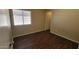 This bedroom has a window for natural light and wood flooring at 22067 W Cantilever St, Buckeye, AZ 85326