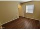 Cozy bedroom featuring wood floors and a closet for ample storage space at 22067 W Cantilever St, Buckeye, AZ 85326