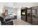 Serene bedroom featuring neutral tones, an entertainment center, and ample natural light at 23219 N 145Th Dr, Sun City West, AZ 85375